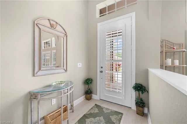 a view of an entryway with wooden floor