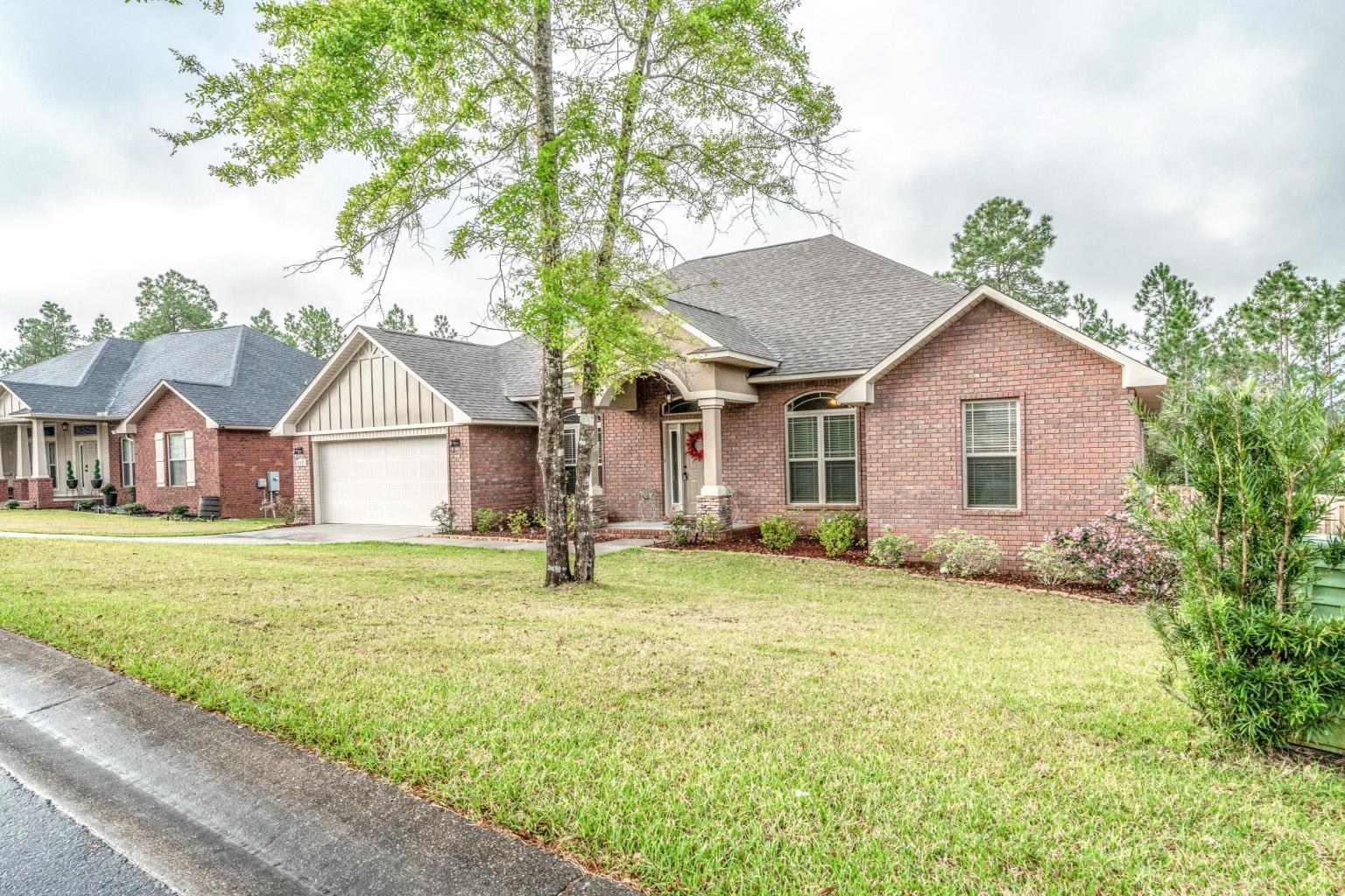 517 Vale Loop Crestview, FL 32536 - Photo 1 of 1 a view of a house with a yard and sitting area