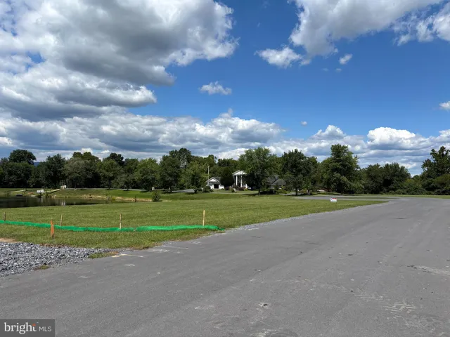 a view of a golf course with a big yard