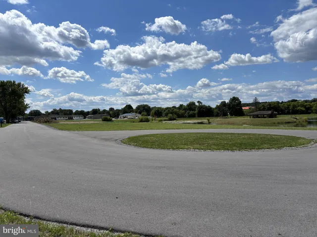 a view of a golf course with a lake