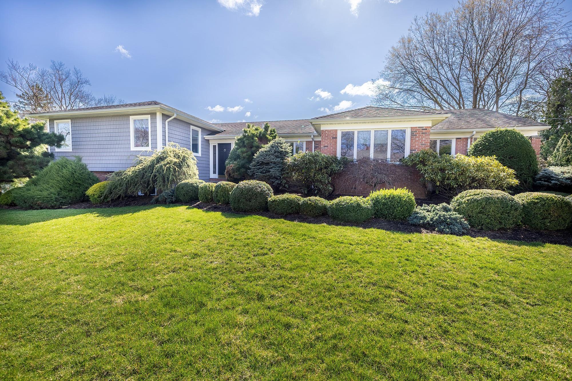 104 Country Ridge Drive Rye Brook, NY 10573 - Photo 1 of 1 a view of a house with backyard and garden