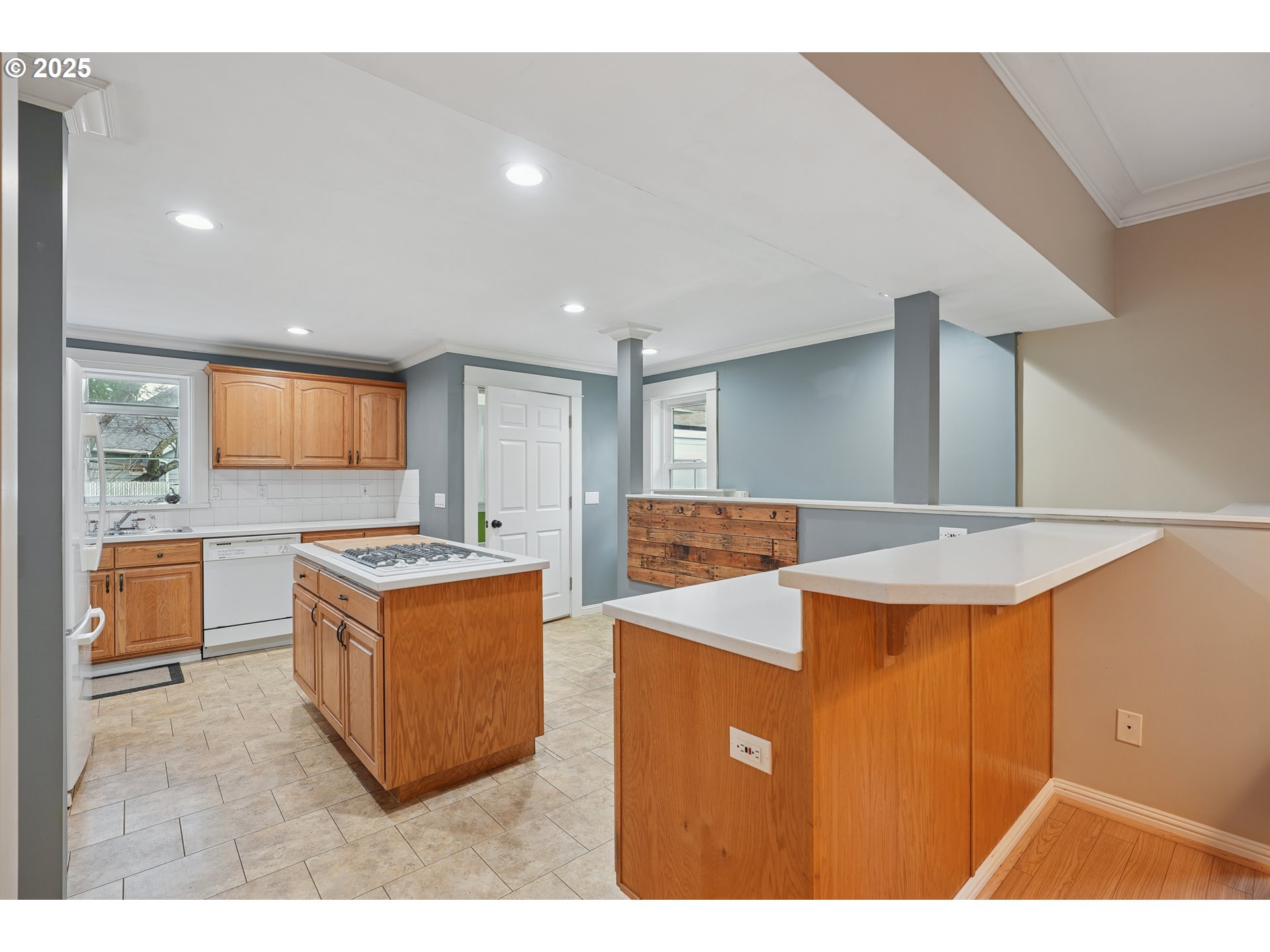 7521 North Jersey Street Portland, OR 97203 - Photo 11 of 18 a living room with stainless steel appliances kitchen island granite countertop a sink a stove top oven a counter space and cabinets