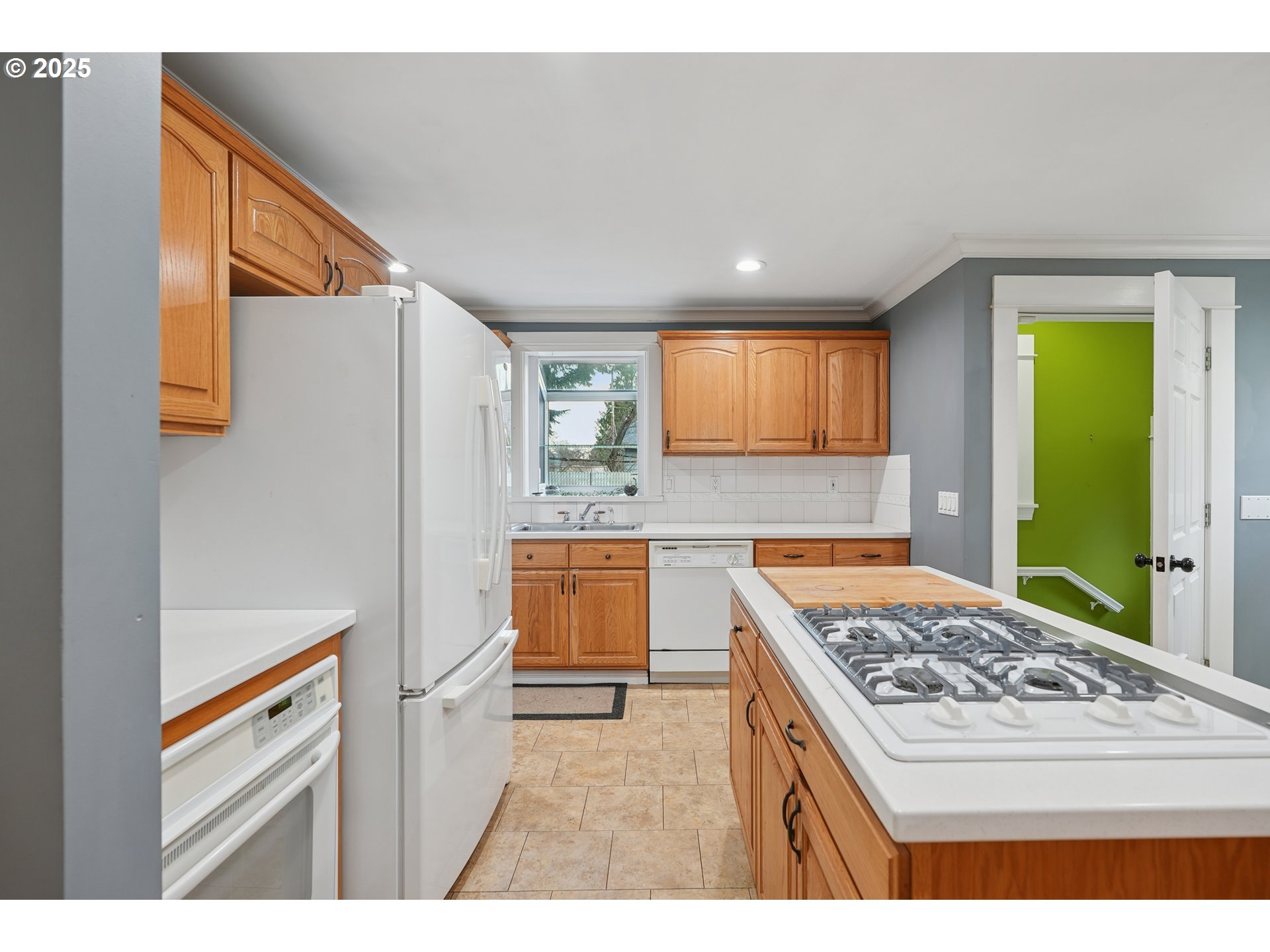7521 North Jersey Street Portland, OR 97203 - Photo 13 of 18 a kitchen with a stove a sink and a refrigerator