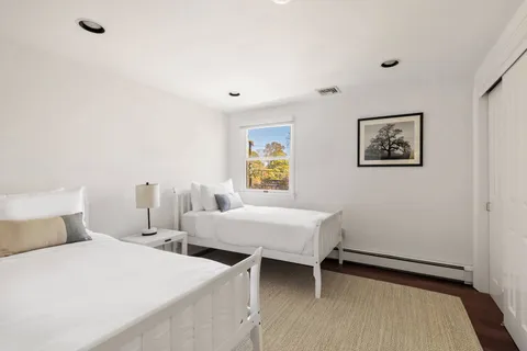 a bed room with a bed and a window