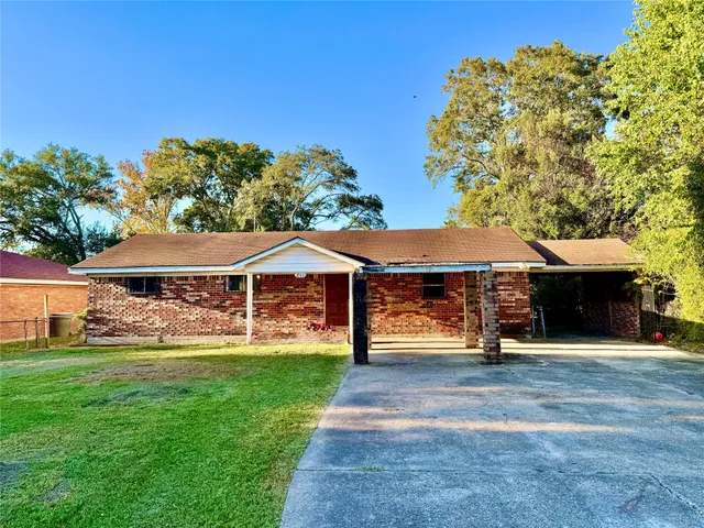 a view of a house with a yard porch and sitting area