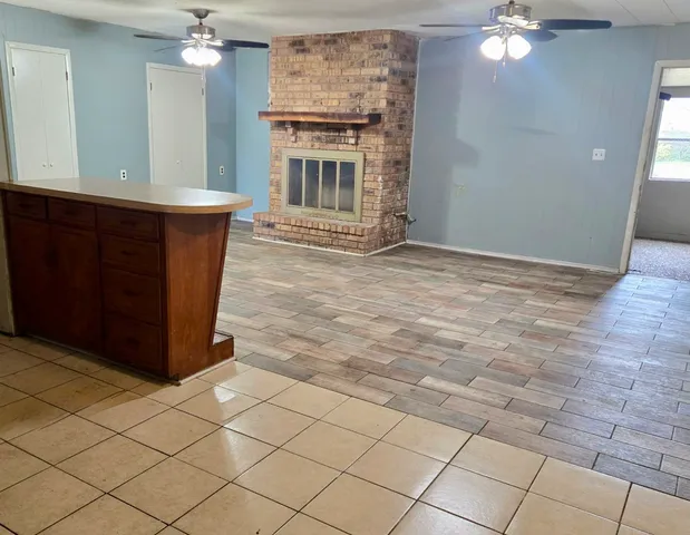 a view of a kitchen with furniture and chandelier