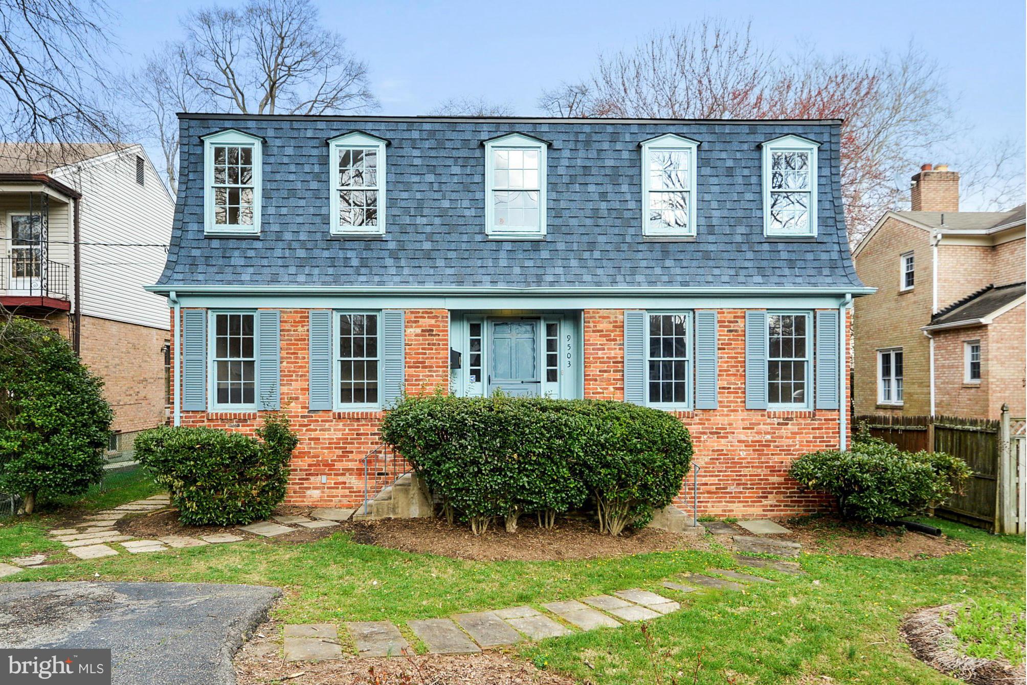 9503 Flower Avenue Silver Spring, MD 20901 - Photo 1 of 30 front view of a brick house with a yard
