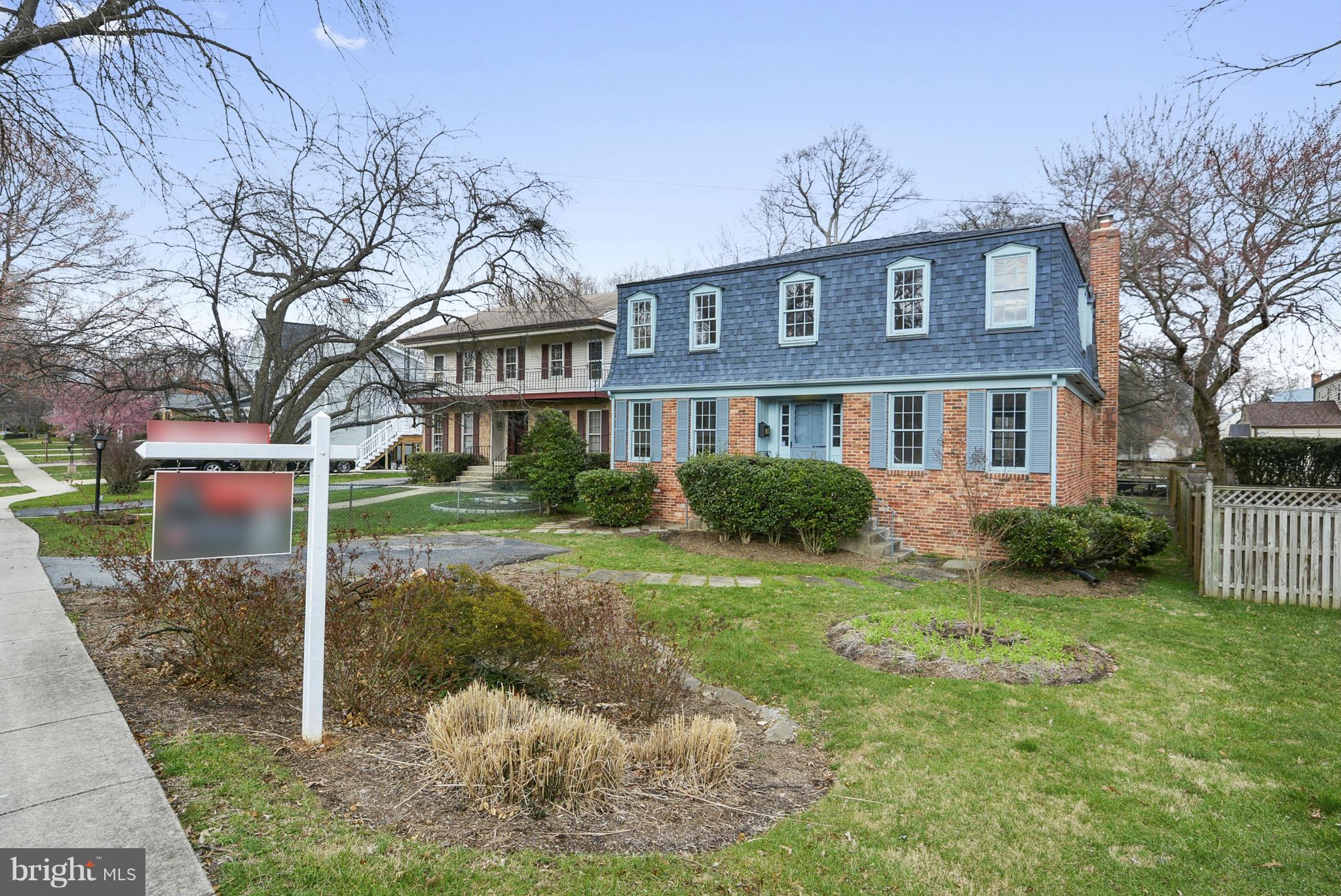 9503 Flower Avenue Silver Spring, MD 20901 - Photo 2 of 30 a front view of a house with garden