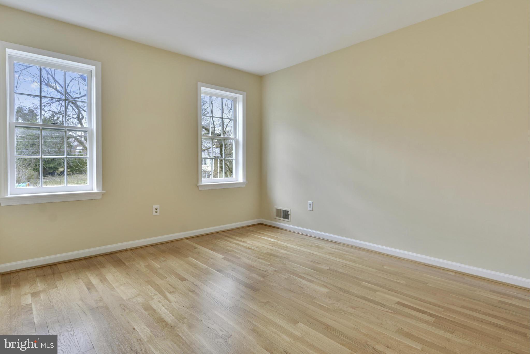 9503 Flower Avenue Silver Spring, MD 20901 - Photo 17 of 30 a view of an empty room with wooden floor and a window