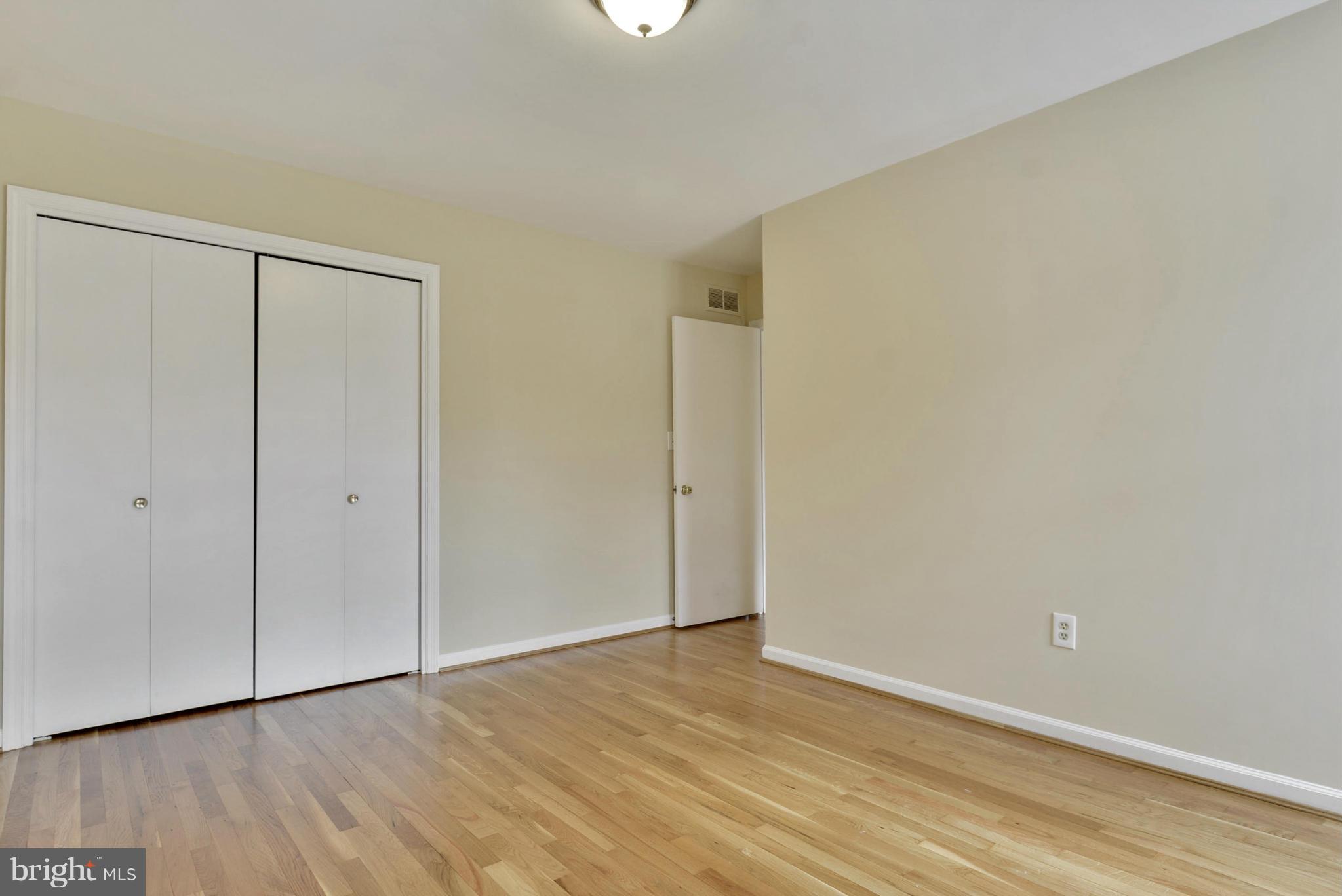 9503 Flower Avenue Silver Spring, MD 20901 - Photo 18 of 30 a view of an empty room with wooden floor