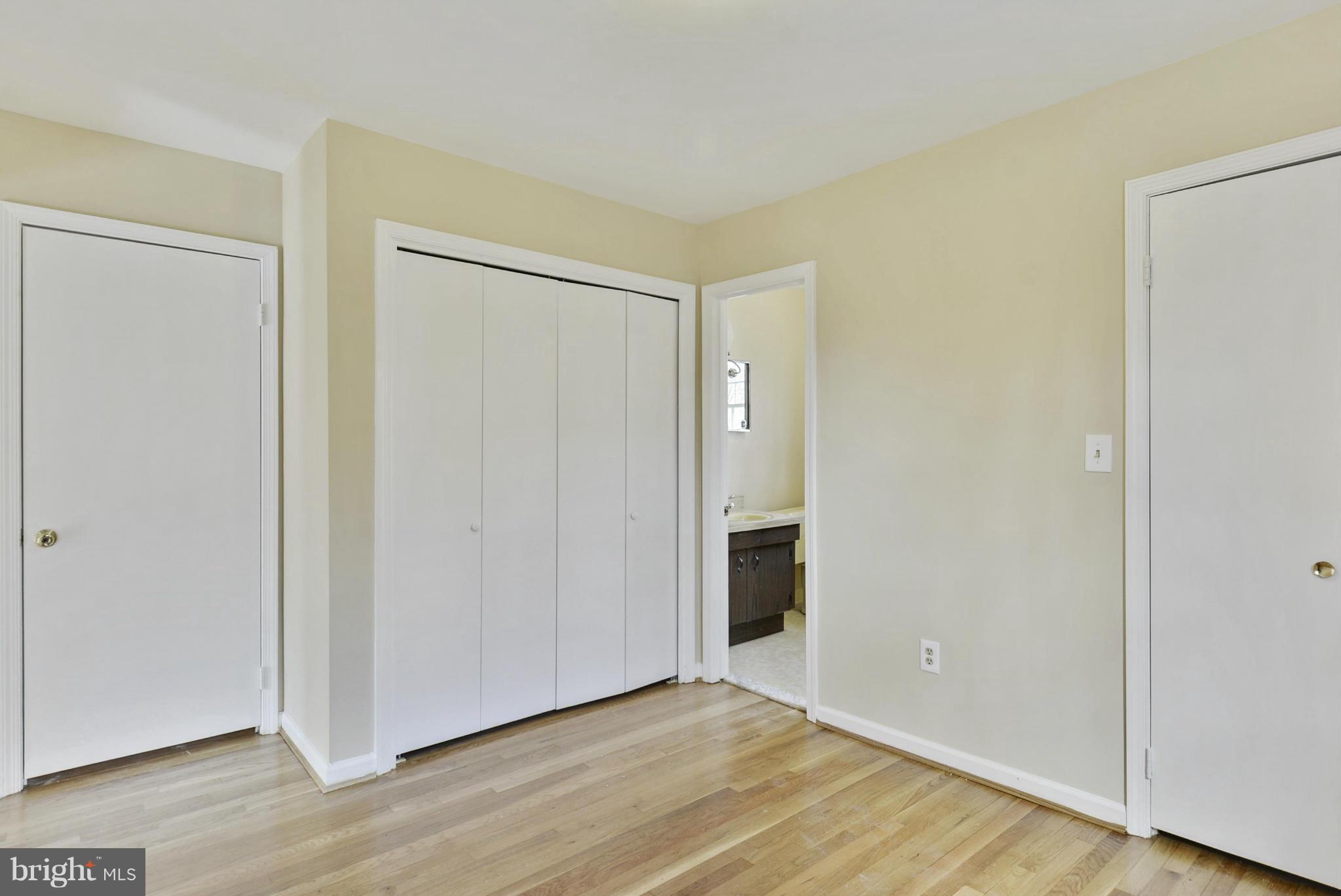 9503 Flower Avenue Silver Spring, MD 20901 - Photo 26 of 30 a view of an empty room with wooden floor