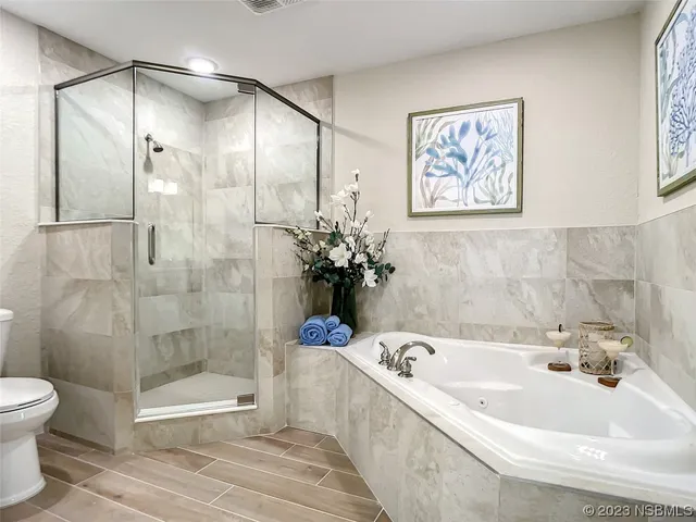 a bathroom with a bathtub and a shower