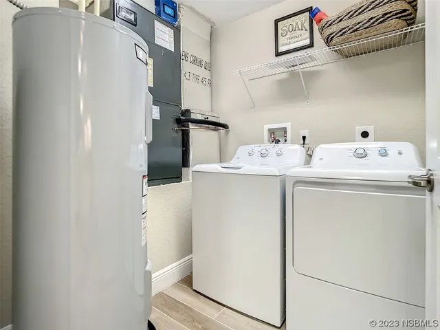 a utility room with dryer and washer