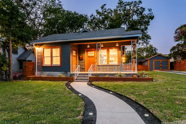 a view of a house with a yard porch and sitting area