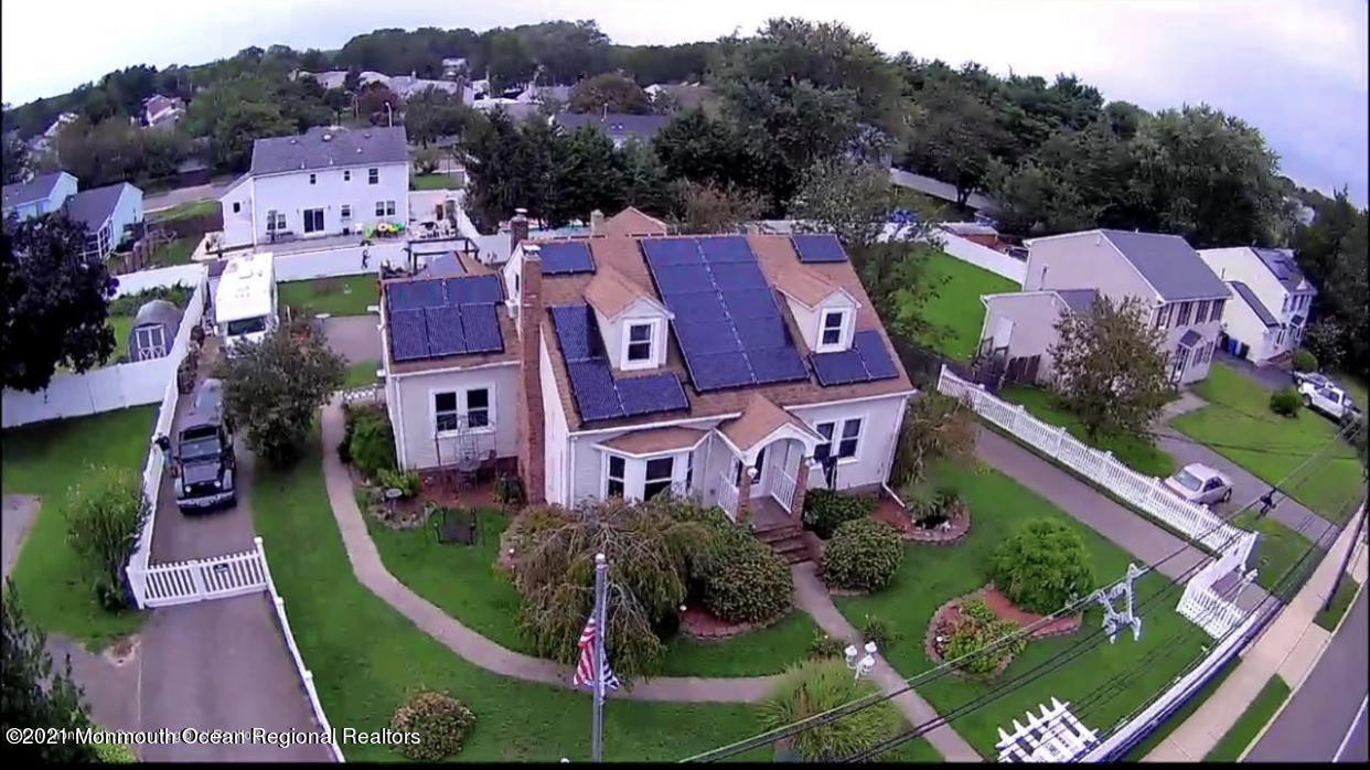 1114 Old Freehold Road Toms River, NJ 08753 - Photo 1 of 1 an aerial view of a house with a garden and lake view