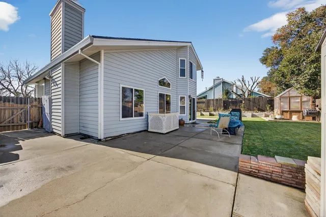 a view of a house with backyard porch and patio