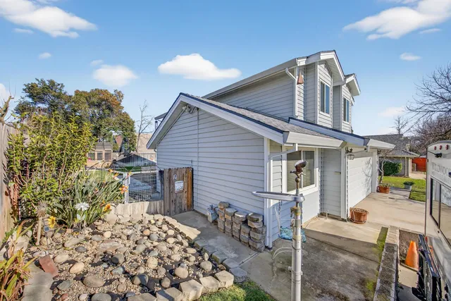an aerial view of a residential apartment building with a yard