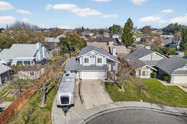 a view of staircase with white walls and a window