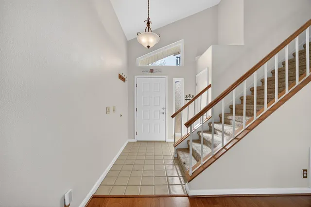 a living room with fireplace furniture and a wooden floor