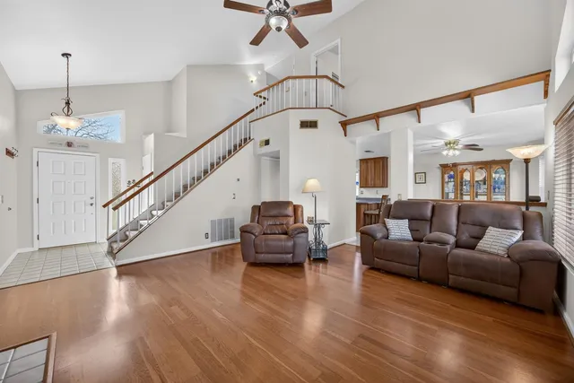 a living room with furniture a fireplace and a window