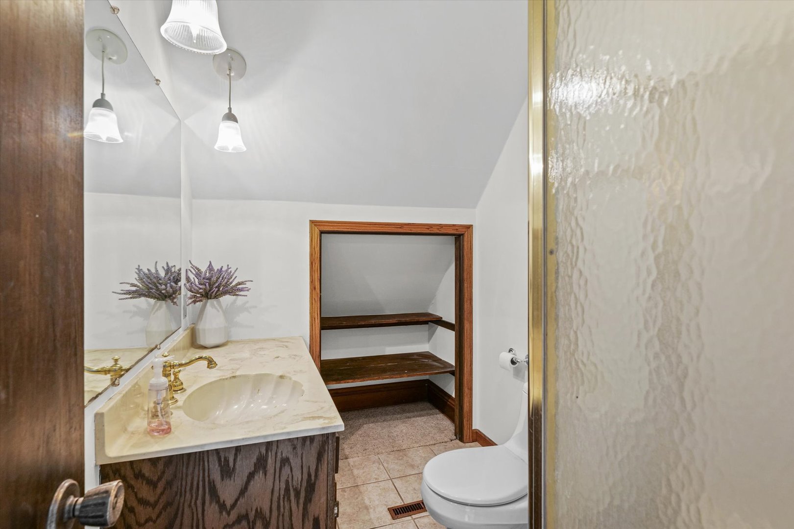 7961 North 3000 E Road Forrest, IL 61741 - Photo 29 of 66 a bathroom with a sink toilet and shower