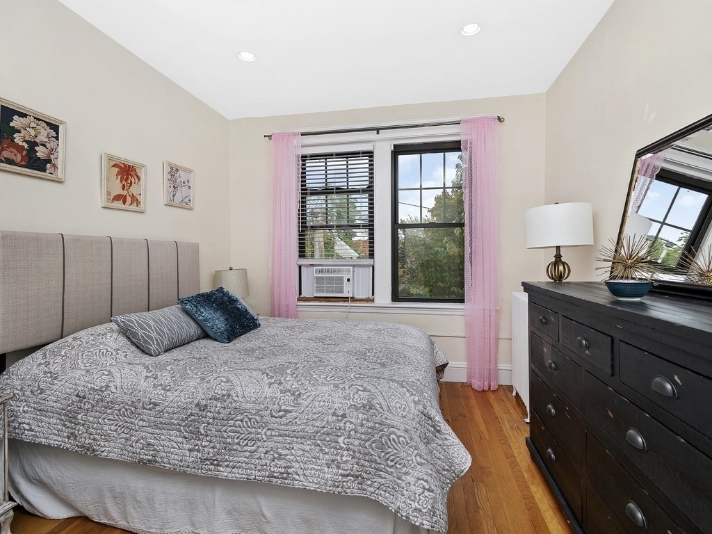31 Winslow Road, Unit 6 Brookline, MA 02446 - Photo 11 of 18 a bedroom with a large bed and a window