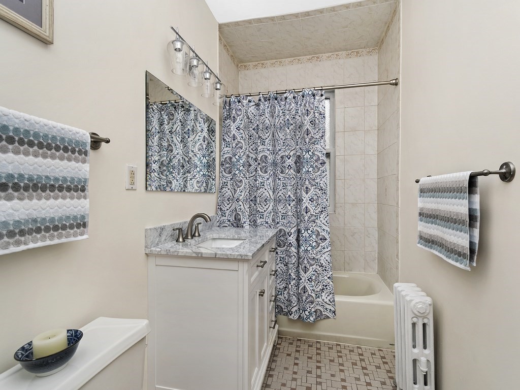 31 Winslow Road, Unit 6 Brookline, MA 02446 - Photo 12 of 18 a bathroom with a sink and a mirror