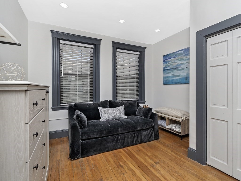 31 Winslow Road, Unit 6 Brookline, MA 02446 - Photo 13 of 18 a living room with furniture and a window