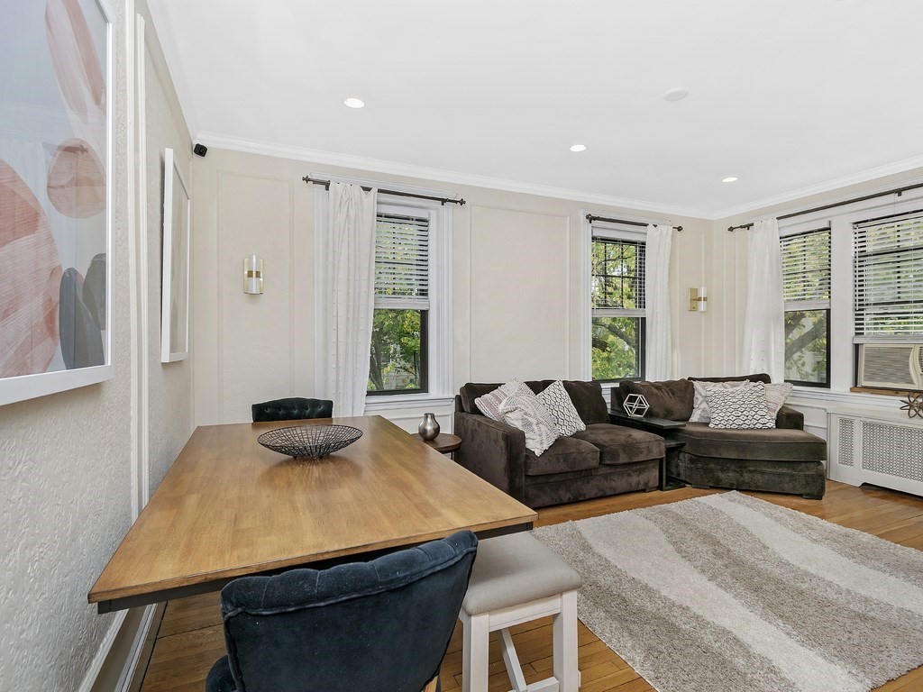 31 Winslow Road, Unit 6 Brookline, MA 02446 - Photo 4 of 18 a living room with furniture and large windows