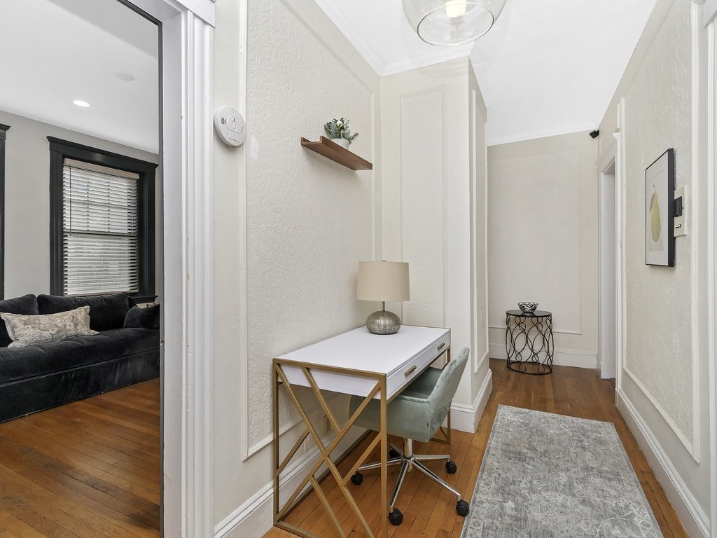 31 Winslow Road, Unit 6 Brookline, MA 02446 - Photo 6 of 18 a view of a livingroom with furniture and a window