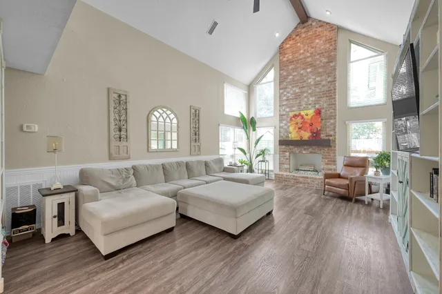 a view of a dining room with furniture window and wooden floor