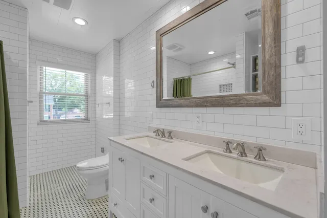 a bedroom with a bed and with view of cabinet