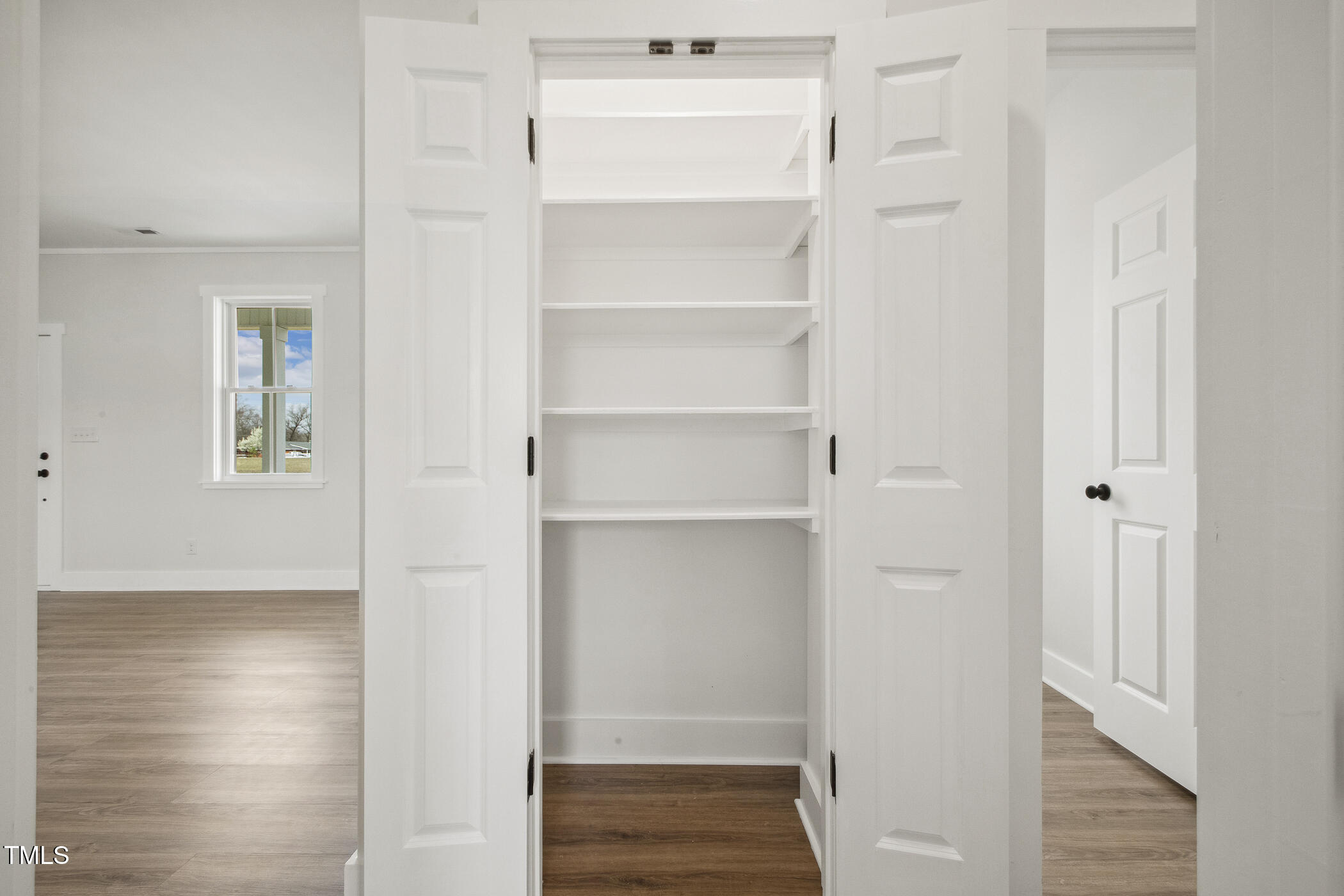 233 Surles Road Benson, NC 27504 - Photo 22 of 57 a view of walk in closet with empty racks