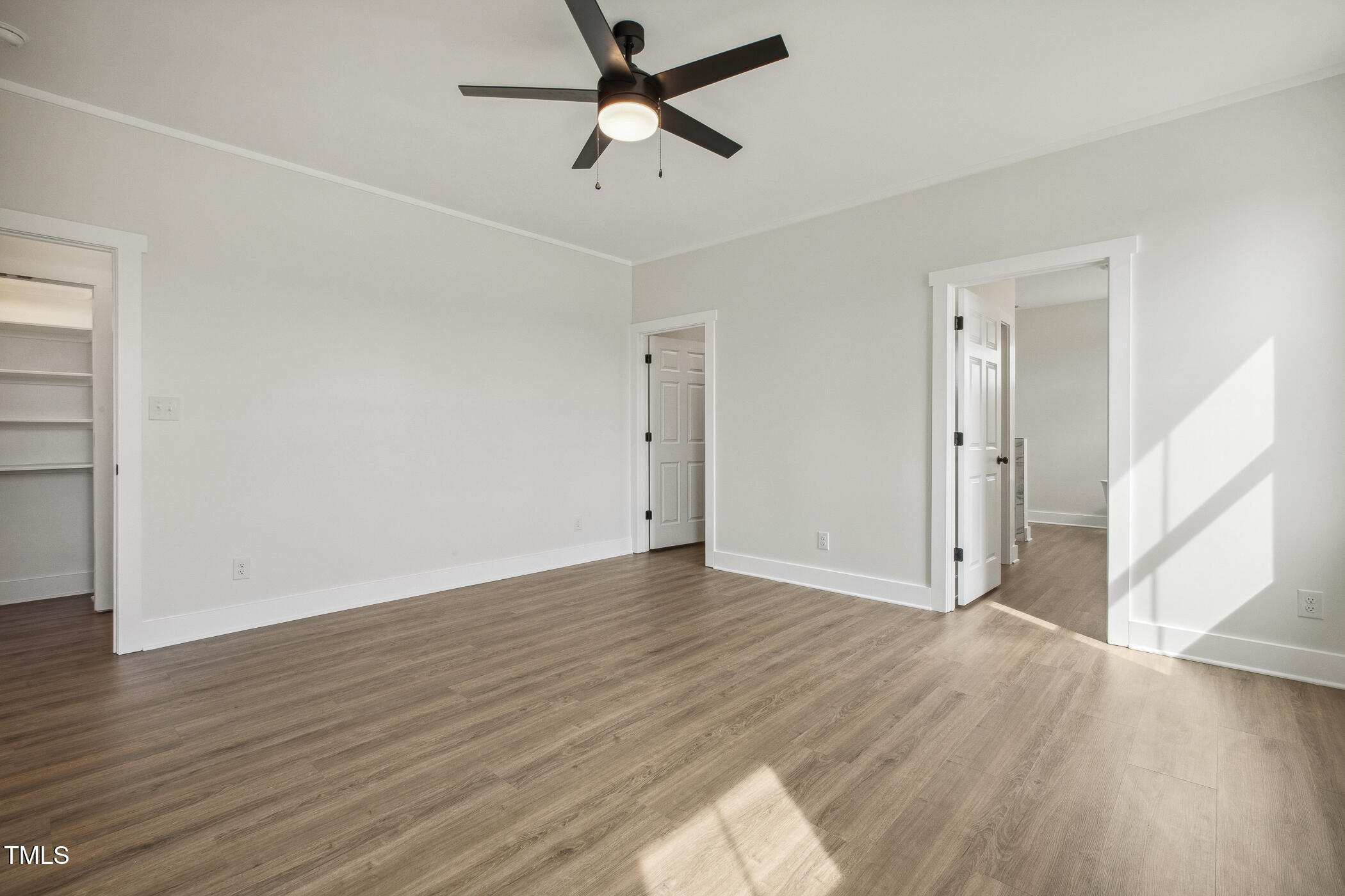 233 Surles Road Benson, NC 27504 - Photo 28 of 57 an empty room with wooden floor and windows