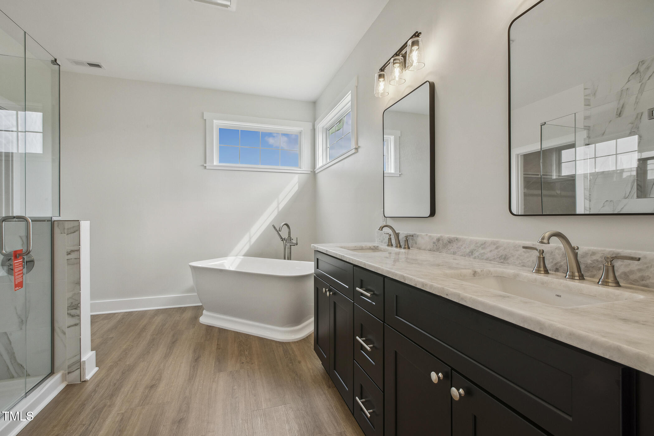 233 Surles Road Benson, NC 27504 - Photo 31 of 57 a bathroom with a sink and a mirror
