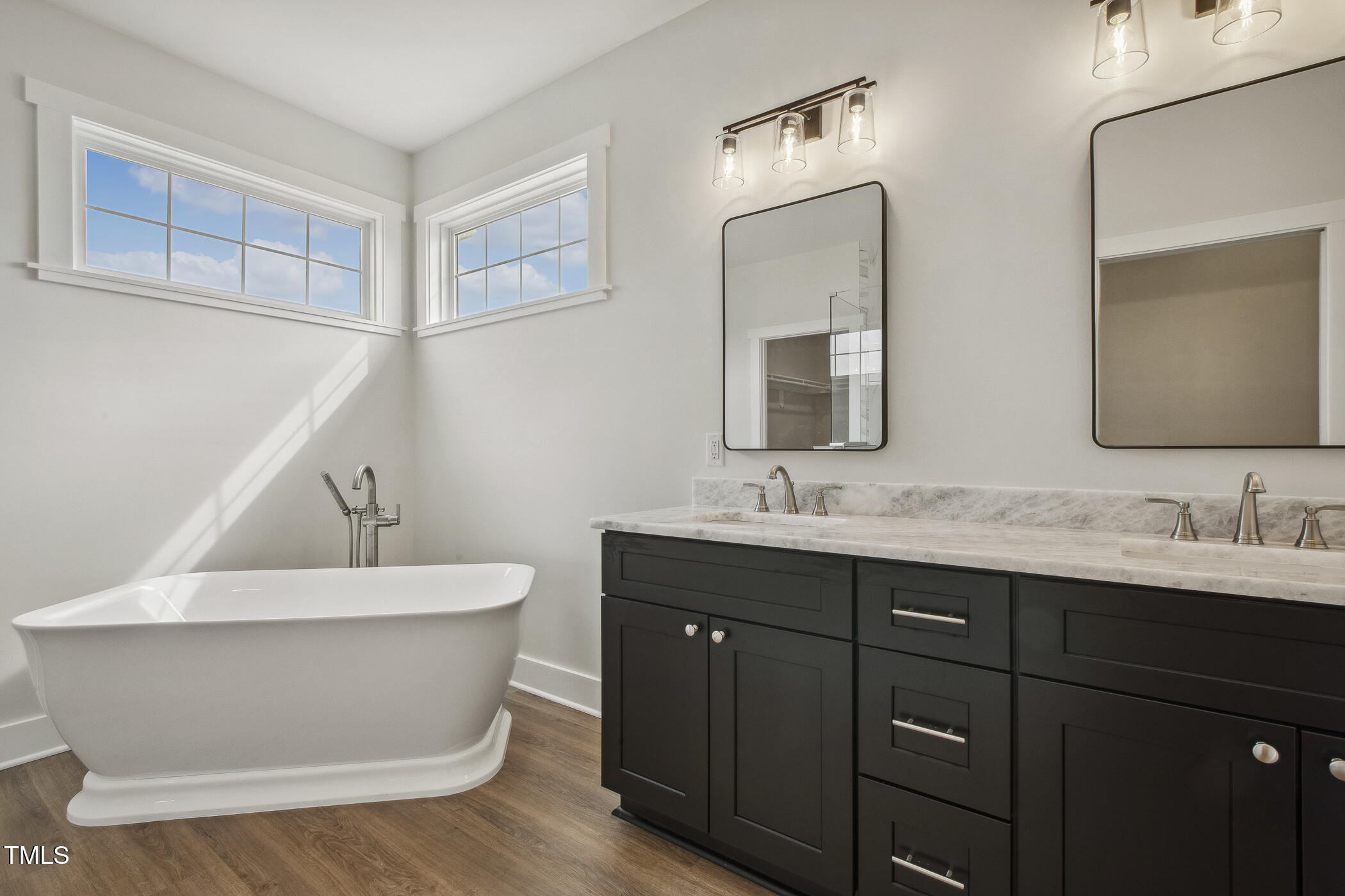 233 Surles Road Benson, NC 27504 - Photo 32 of 57 a bathroom with a sink and a mirror