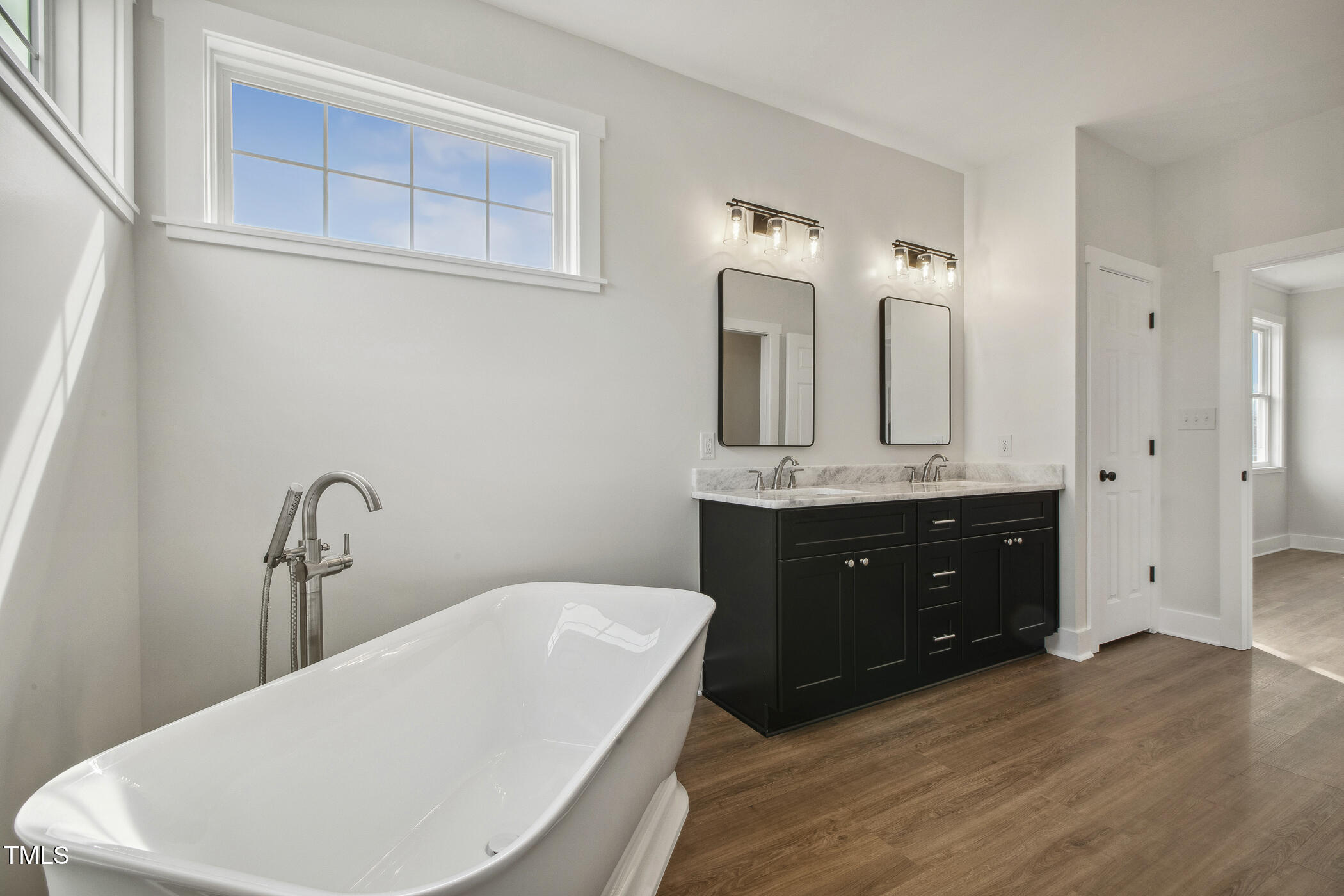 233 Surles Road Benson, NC 27504 - Photo 34 of 57 a bathroom with a double vanity sink and mirror