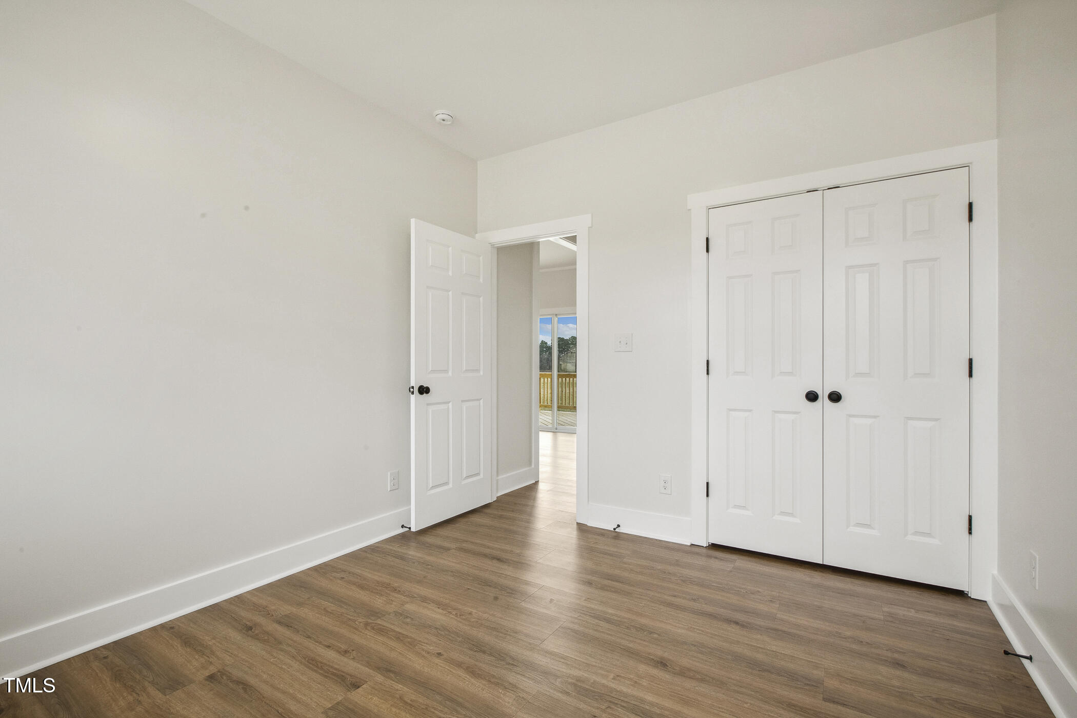233 Surles Road Benson, NC 27504 - Photo 38 of 57 a view of an empty room with wooden floor