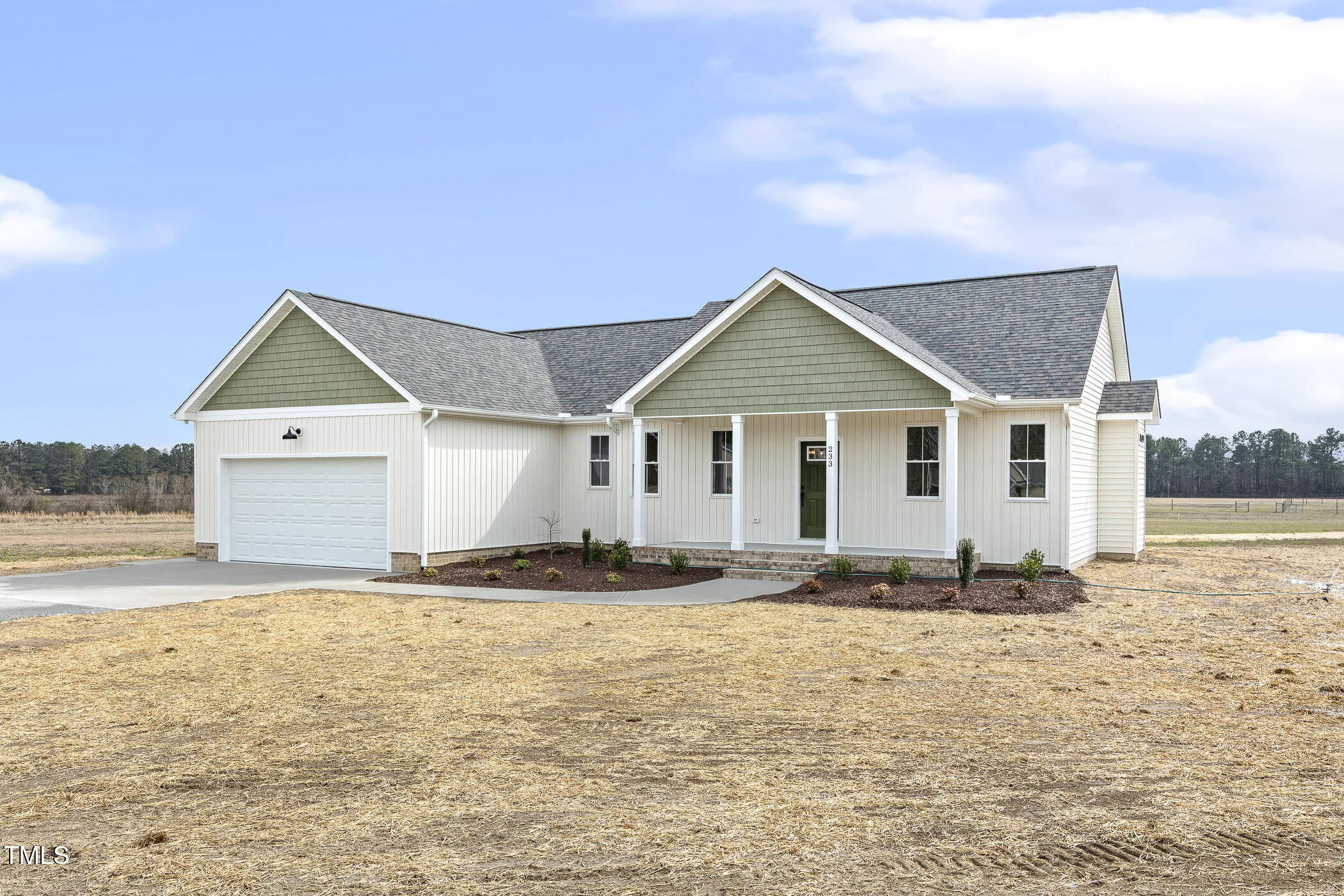 233 Surles Road Benson, NC 27504 - Photo 4 of 57 a front view of a house with a yard