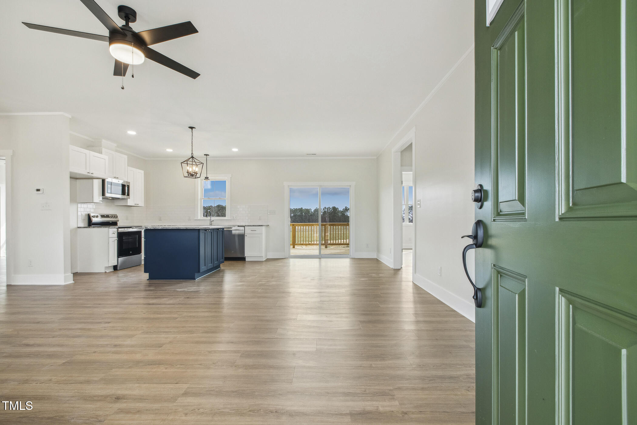 233 Surles Road Benson, NC 27504 - Photo 8 of 57 a view of kitchen and hall with wooden floor
