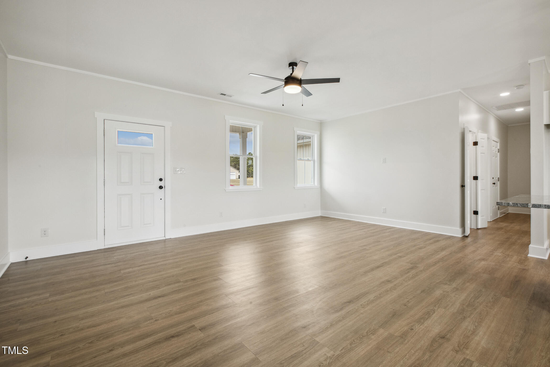 233 Surles Road Benson, NC 27504 - Photo 10 of 57 wooden floor in an empty room with a window