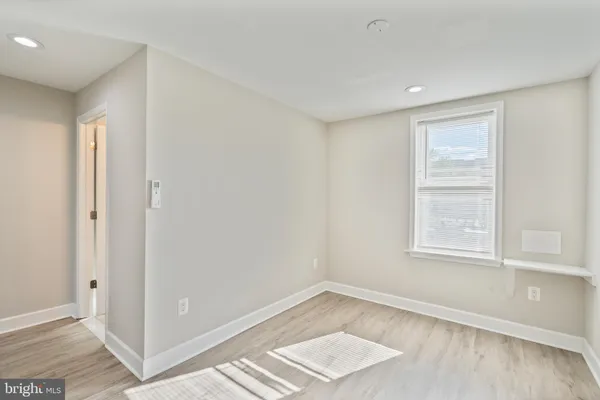 a view of an empty room and window