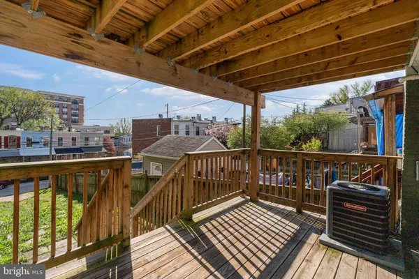 a view of balcony with wooden floor