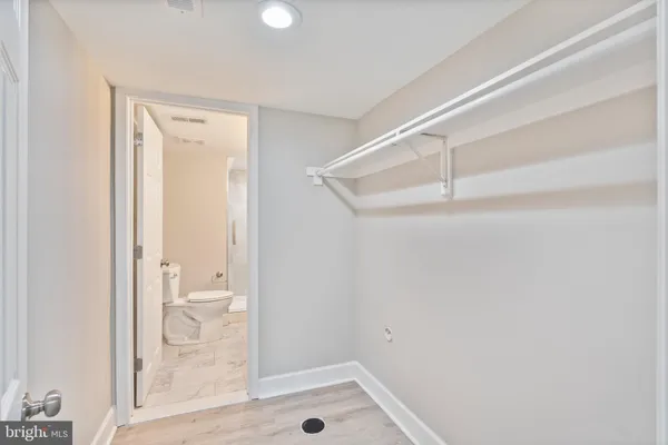a bathroom with a glass shower door