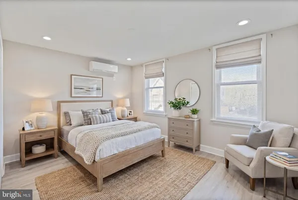 a bedroom with a bed and a couch