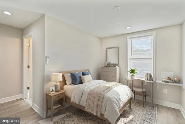 a bed room with a bed and a chair