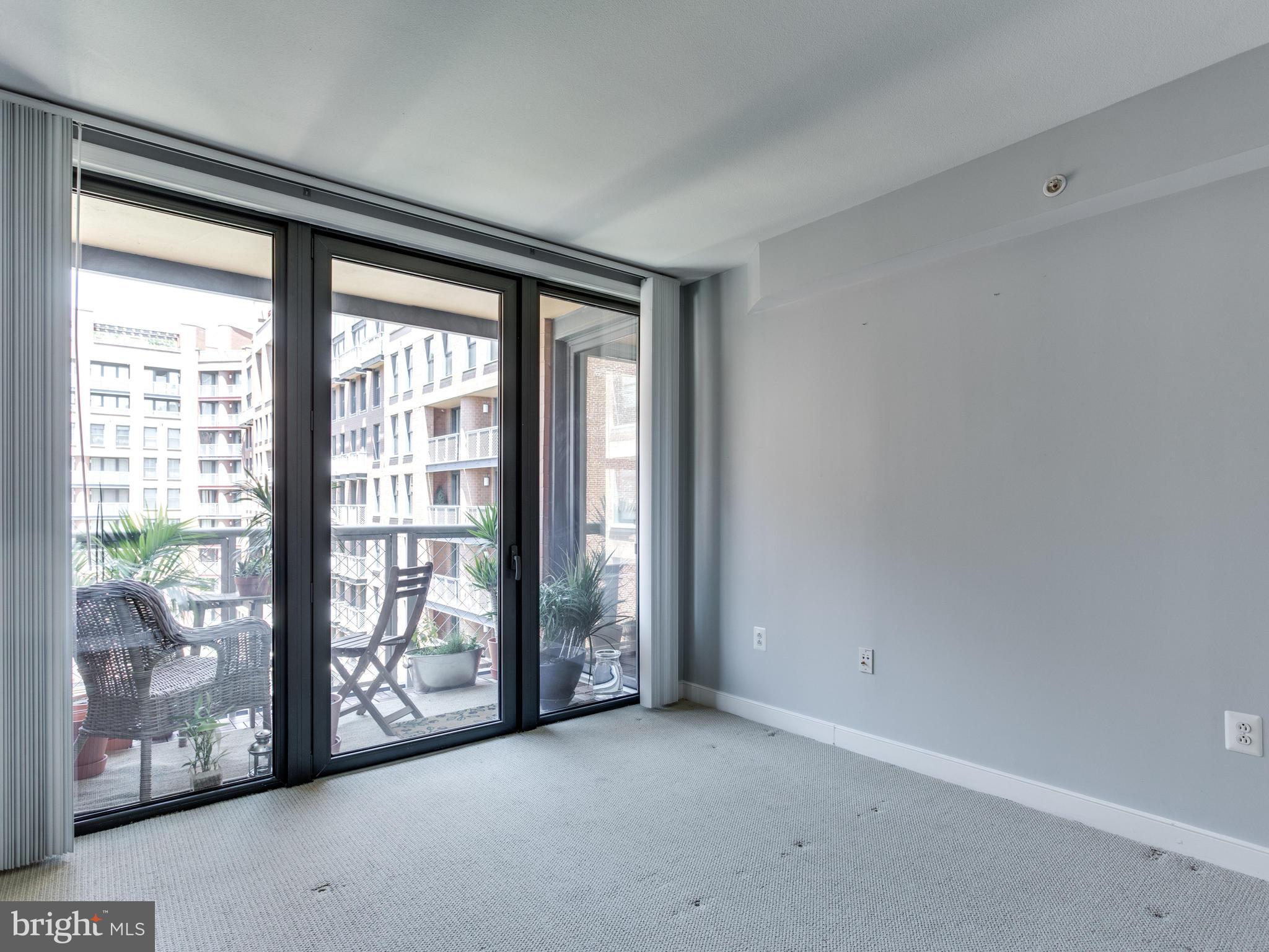 631 D Street Northwest, Unit 837 Washington, DC 20004 - Photo 12 of 29 a view of an empty room with windows