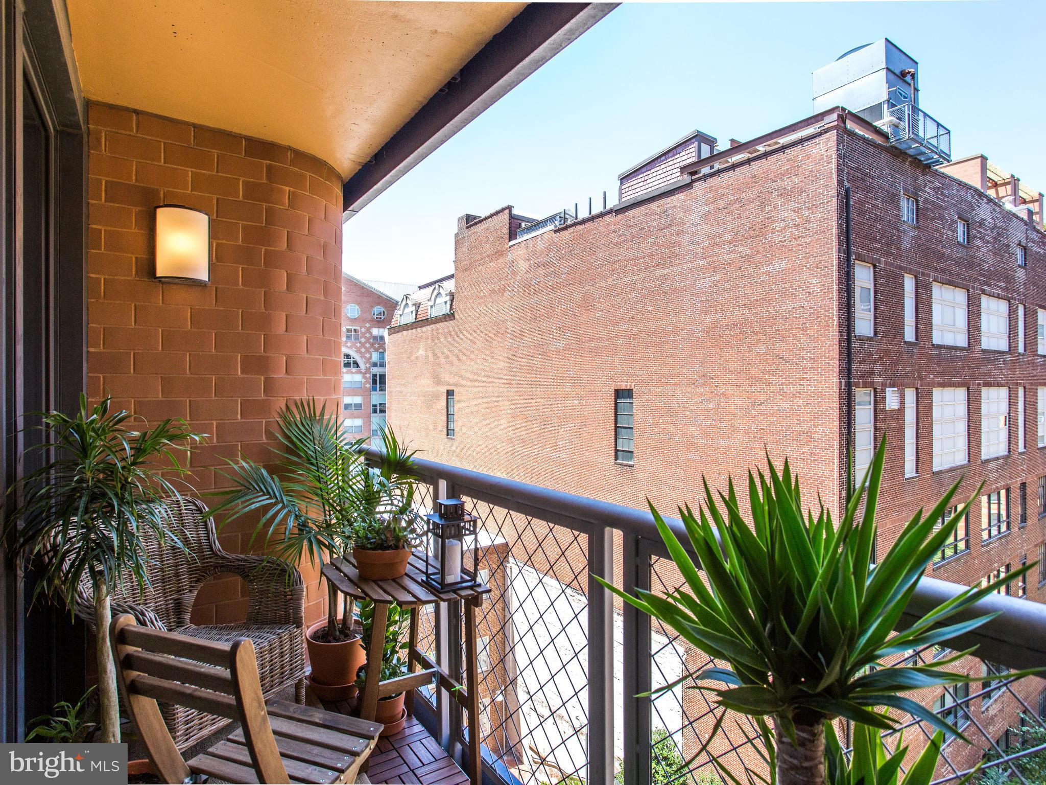 631 D Street Northwest, Unit 837 Washington, DC 20004 - Photo 13 of 29 a balcony view with a potted plant on it