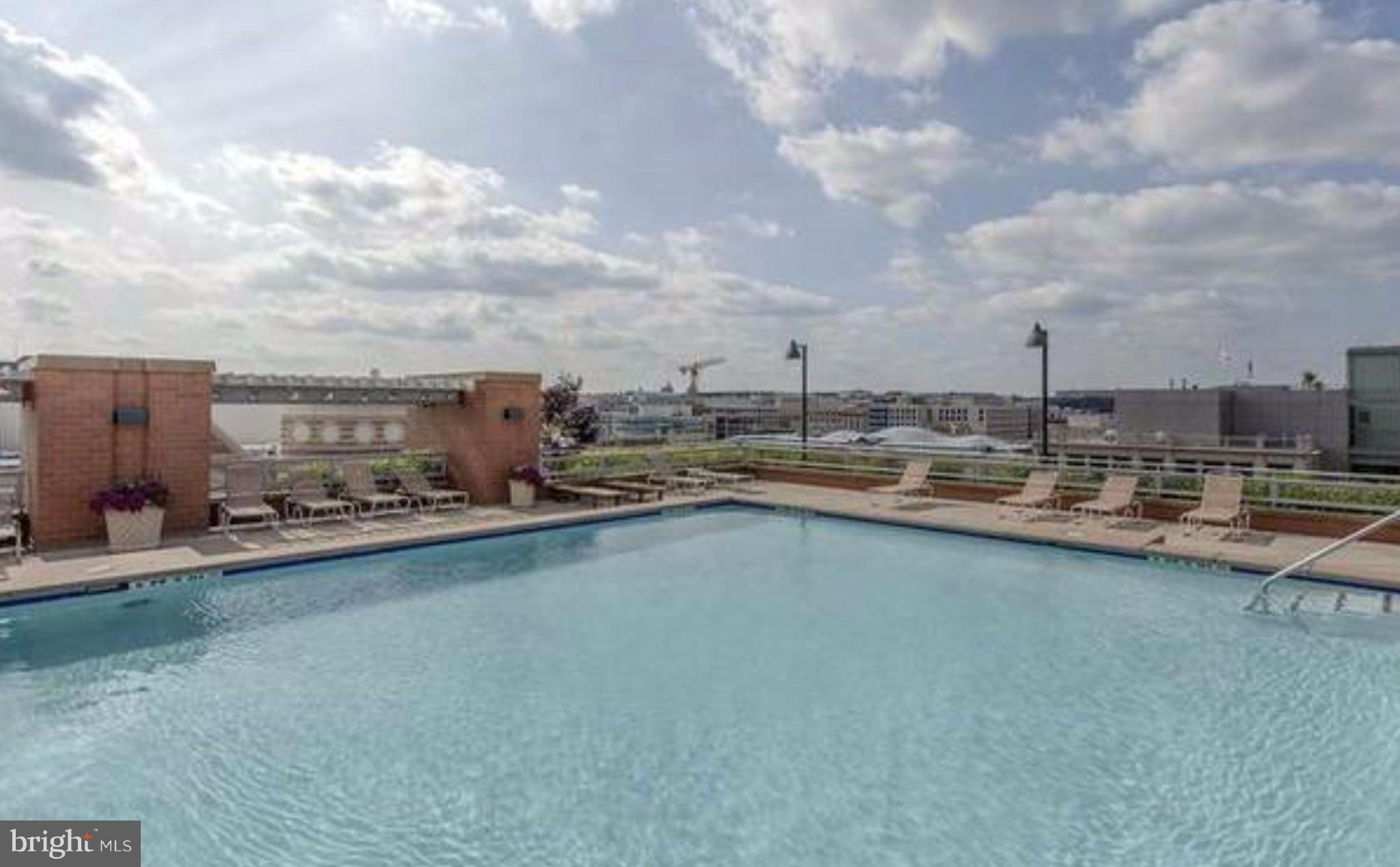 631 D Street Northwest, Unit 837 Washington, DC 20004 - Photo 28 of 29 a view of outdoor space with swimming pool and furniture