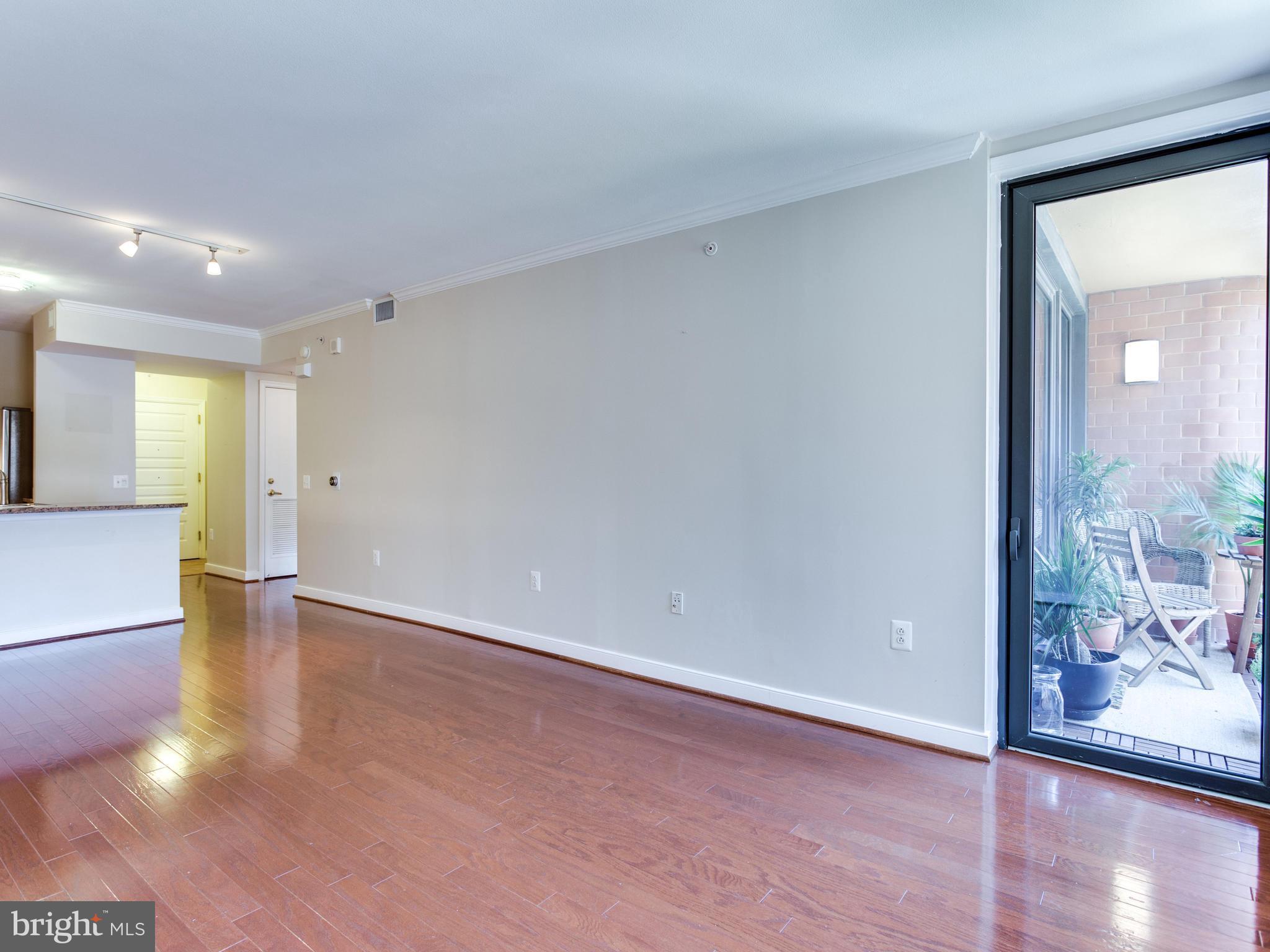 631 D Street Northwest, Unit 837 Washington, DC 20004 - Photo 10 of 29 a view of an empty room and wooden floor